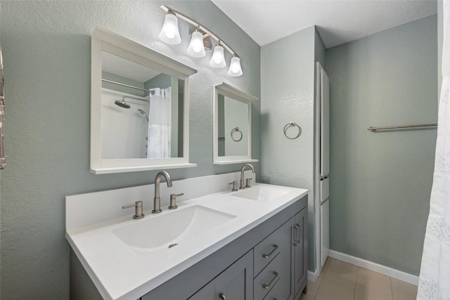 14585 Robert I Walker Blvd, Austin, TX 78728 - full bath with double vanity, tile patterned flooring, and a textured wall