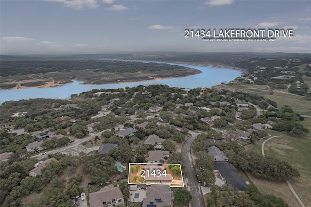 21434 Lakefront Dr, Lago Vista, TX 78645 - aerial view of residential area with a nearby body of water and property boundaries highlighted