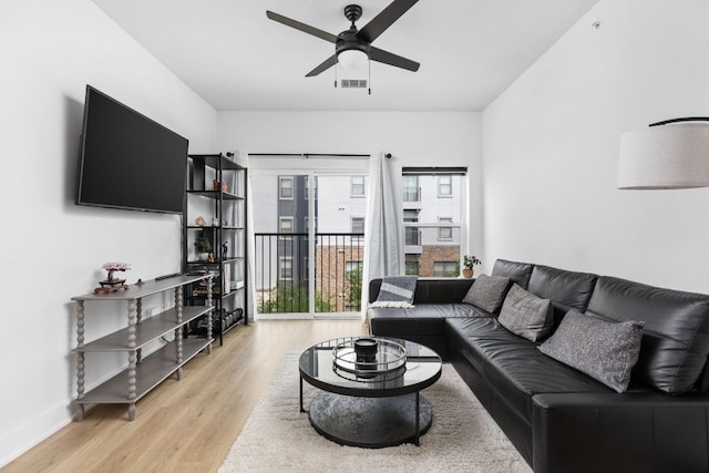 2500 Longview St Unit 418, Austin, TX 78705 - living room with ceiling fan and light wood-style flooring