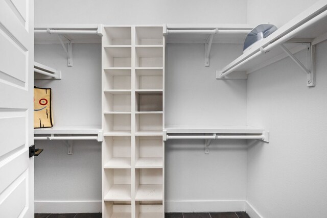 2500 Longview St Unit 418, Austin, TX 78705 - walk in closet featuring dark tile patterned flooring
