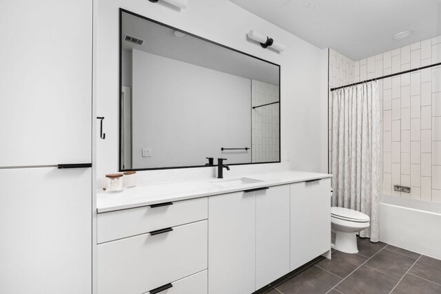 2500 Longview St Unit 418, Austin, TX 78705 - full bathroom featuring vanity, toilet, shower / tub combo, and tile patterned flooring