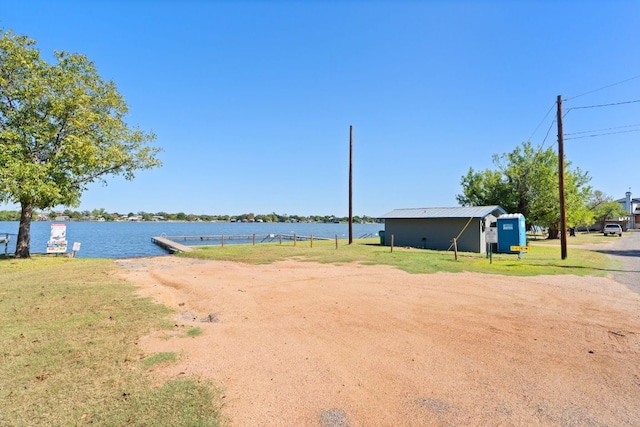 125 Channel Dr, Sunrise Beach, TX 78643 - view of property's community featuring a lawn and a water view