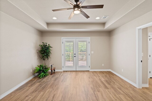 125 Channel Dr, Sunrise Beach, TX 78643 - empty room with ceiling fan, visible vents, light wood-style floors, baseboards, and french doors