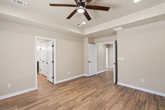 125 Channel Dr, Sunrise Beach, TX 78643 - unfurnished bedroom featuring recessed lighting, visible vents, wood finished floors, and baseboards