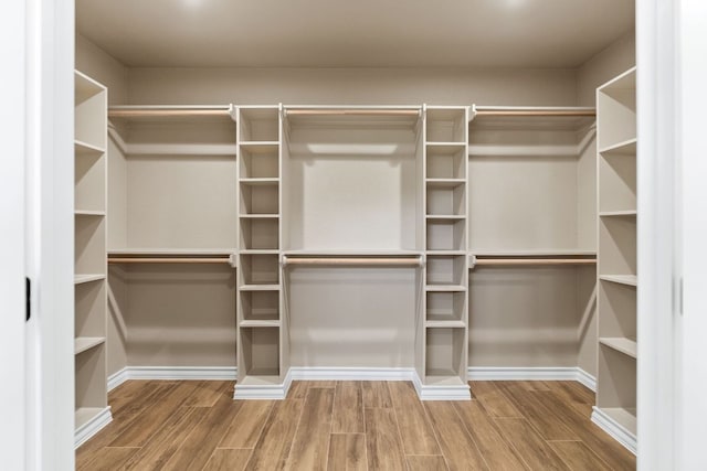 125 Channel Dr, Sunrise Beach, TX 78643 - walk in closet featuring wood finished floors