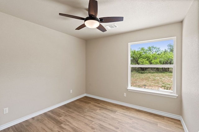 125 Channel Dr, Sunrise Beach, TX 78643 - spare room featuring visible vents, ceiling fan, light wood-style flooring, and baseboards