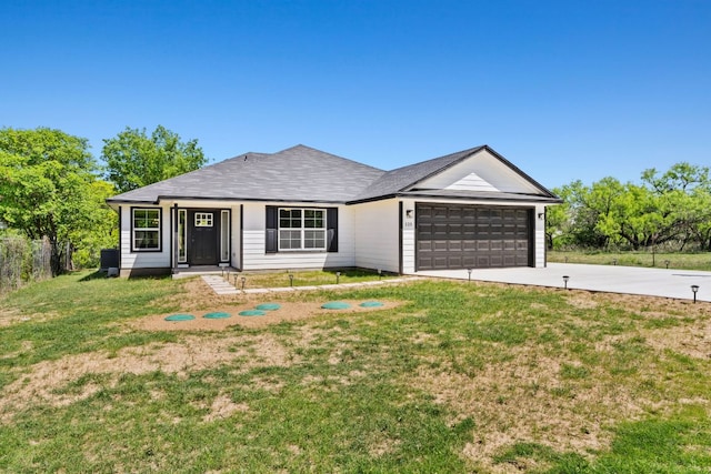 125 Channel Dr, Sunrise Beach, TX 78643 - ranch-style home featuring fence, a front lawn, concrete driveway, and an attached garage
