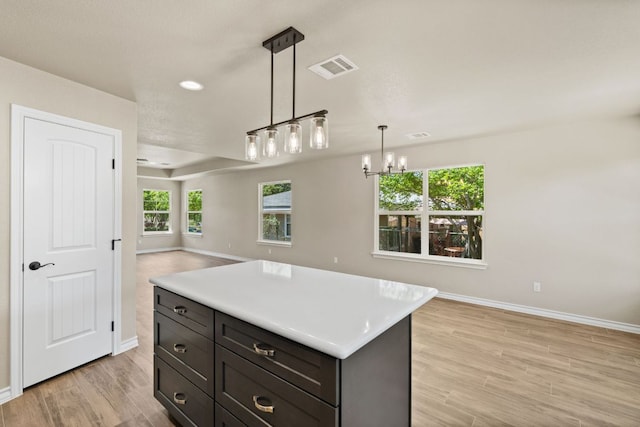 125 Channel Dr, Sunrise Beach, TX 78643 - kitchen with baseboards, light wood-type flooring, visible vents, and open floor plan