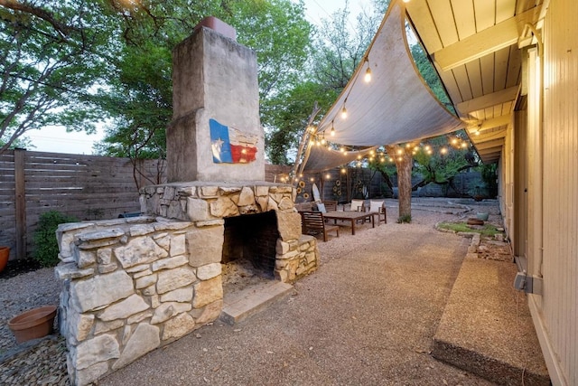 2301 Westway Cir, Austin, TX 78704 - view of patio / terrace featuring an outdoor stone fireplace