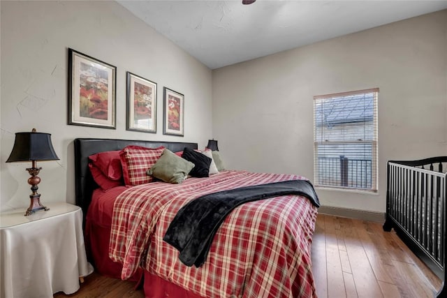 202 Bridgepoint Dr, Kingsland, TX 78639 - bedroom featuring wood-type flooring and baseboards