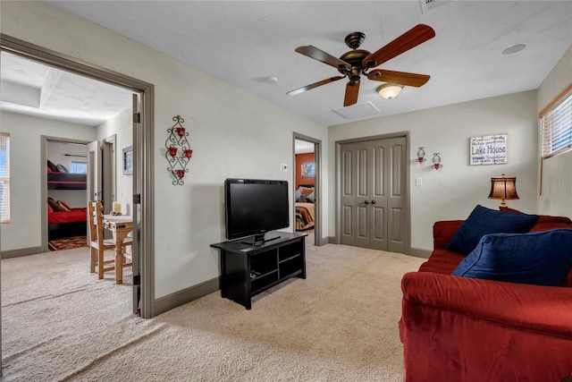 202 Bridgepoint Dr, Kingsland, TX 78639 - living area featuring light colored carpet, ceiling fan, and baseboards