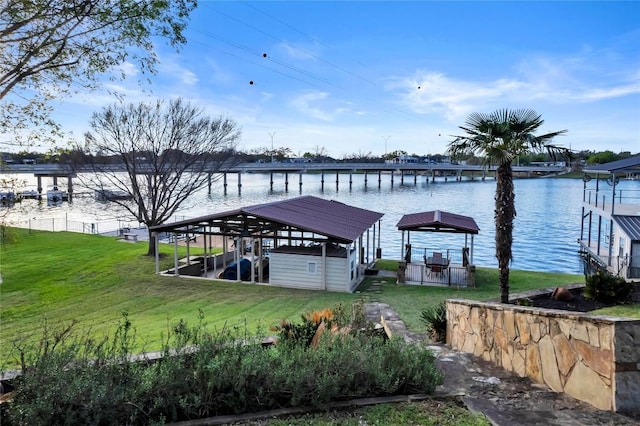 202 Bridgepoint Dr, Kingsland, TX 78639 - dock featuring a lawn, a water view, and boat lift