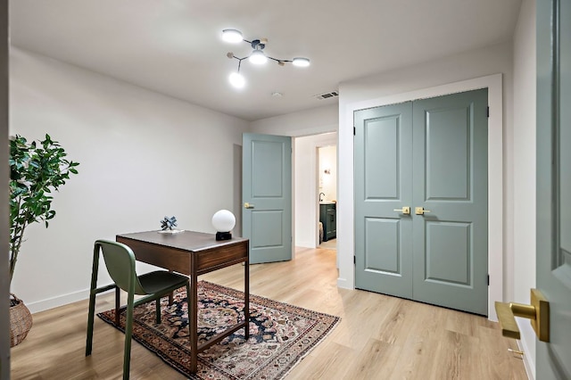 7614 Watson St, Austin, TX 78757 - office area featuring light wood-type flooring and baseboards