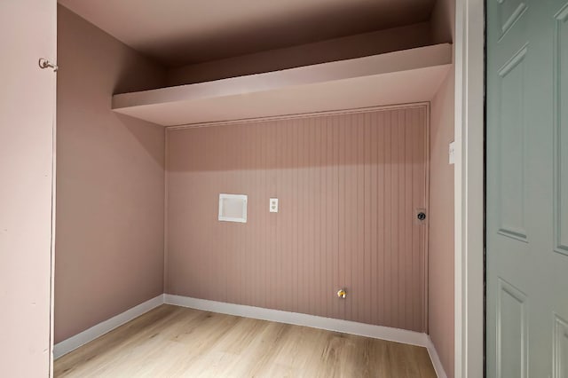 7614 Watson St, Austin, TX 78757 - laundry area with light wood-type flooring and baseboards