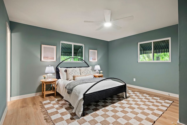 7614 Watson St, Austin, TX 78757 - bedroom featuring light wood-style floors, baseboards, and ceiling fan