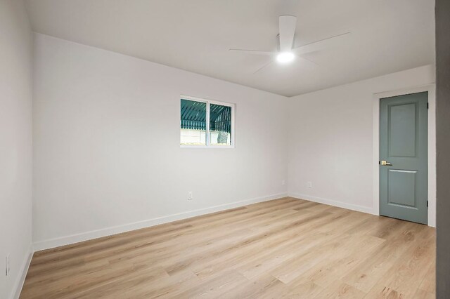7614 Watson St, Austin, TX 78757 - empty room with ceiling fan, light wood finished floors, and baseboards