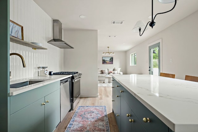 7614 Watson St, Austin, TX 78757 - kitchen featuring island range hood, a sink, light wood-type flooring, stainless steel dishwasher, and open floor plan
