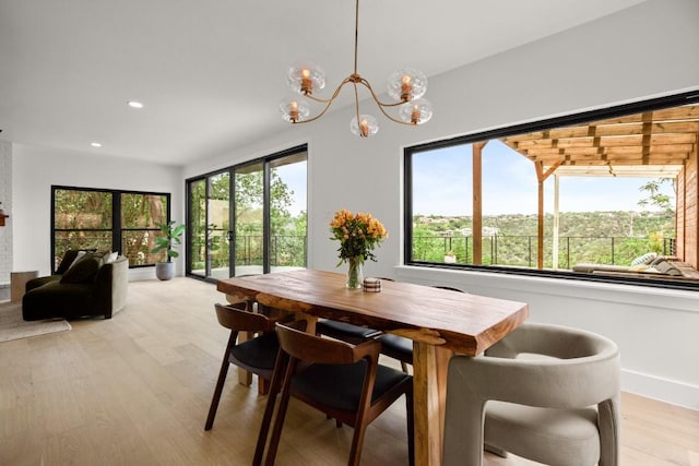4328 Far W Blvd, Austin, TX 78731 - dining room with light wood-type flooring, recessed lighting, and a notable chandelier