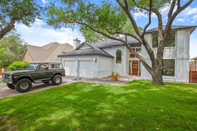 4328 Far W Blvd, Austin, TX 78731 - view of front facade with a chimney, a front yard, a garage, brick siding, and concrete driveway