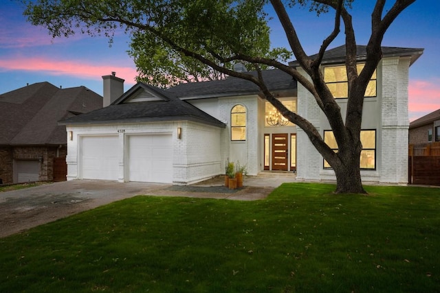 4328 Far W Blvd, Austin, TX 78731 - view of front of property with an attached garage, a front lawn, brick siding, a chimney, and concrete driveway