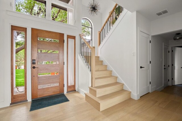 4328 Far W Blvd, Austin, TX 78731 - foyer with stairs, wood finished floors, and visible vents