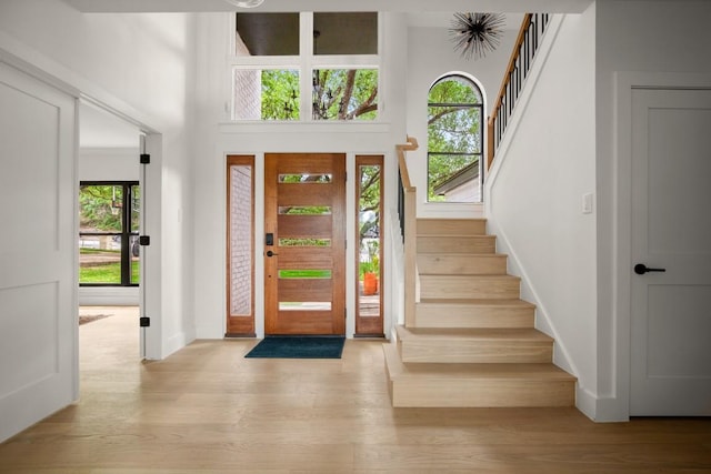 4328 Far W Blvd, Austin, TX 78731 - foyer with plenty of natural light, stairway, wood finished floors, and a high ceiling