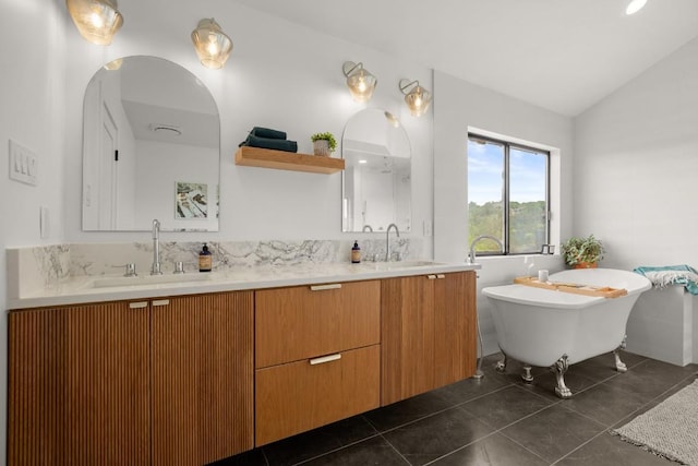4328 Far W Blvd, Austin, TX 78731 - full bathroom with tile patterned flooring, double vanity, lofted ceiling, a freestanding bath, and a sink
