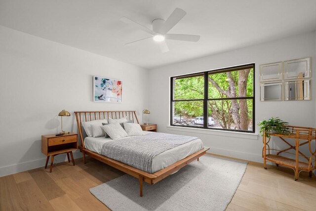 4328 Far W Blvd, Austin, TX 78731 - bedroom with baseboards, ceiling fan, and light wood-style flooring