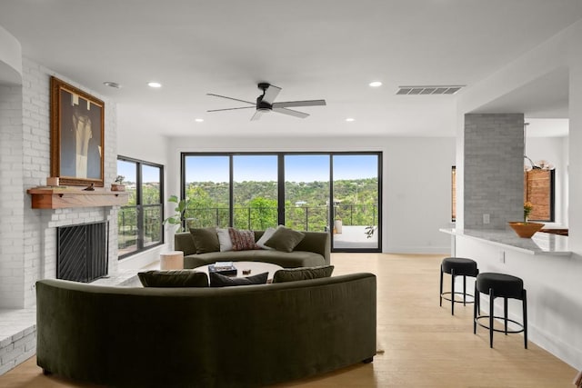 4328 Far W Blvd, Austin, TX 78731 - living room with ceiling fan, a fireplace, recessed lighting, light wood-type flooring, and visible vents