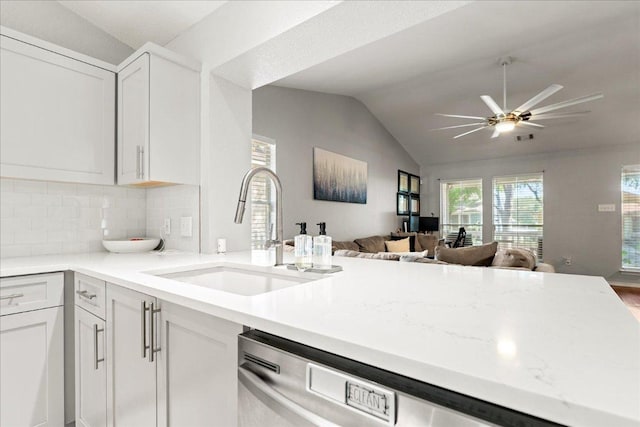 4456 Mather, Kyle, TX 78640 - kitchen featuring a sink, open floor plan, lofted ceiling, ceiling fan, and tasteful backsplash