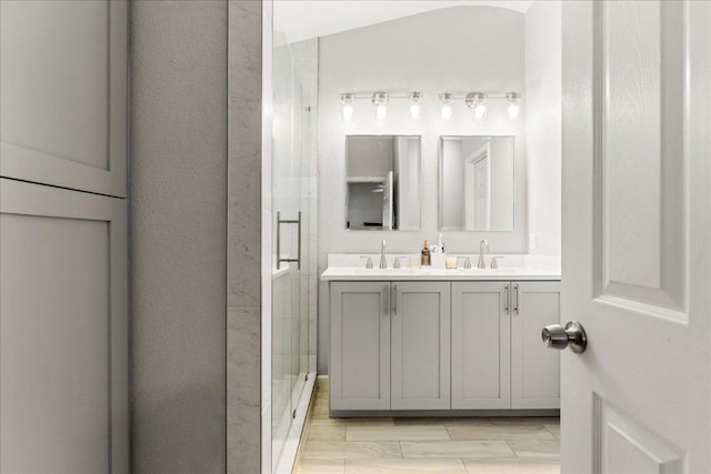 4456 Mather, Kyle, TX 78640 - bathroom featuring double vanity and a stall shower