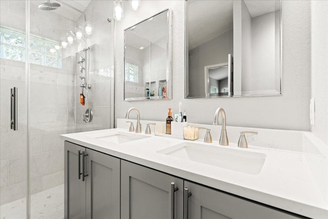 4456 Mather, Kyle, TX 78640 - bathroom with a shower stall, double vanity, and healthy amount of natural light