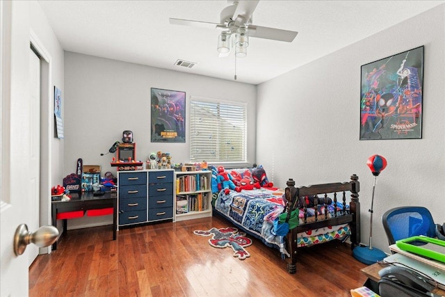 4456 Mather, Kyle, TX 78640 - bedroom featuring wood finished floors and a ceiling fan