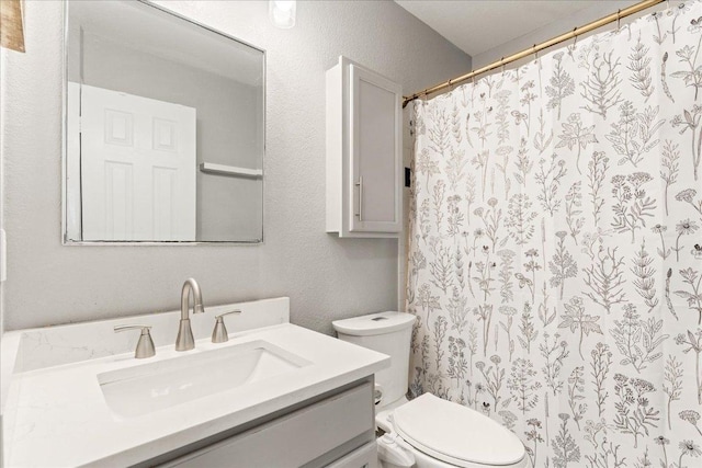4456 Mather, Kyle, TX 78640 - full bath featuring vanity, toilet, curtained shower, and a textured wall