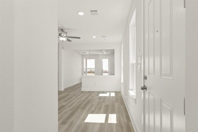 2031 Cora Ivy Ln, Round Rock, TX 78665 - hall with baseboards, light wood-style flooring, and recessed lighting