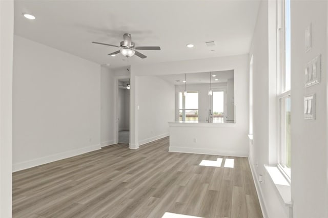 2031 Cora Ivy Ln, Round Rock, TX 78665 - unfurnished living room featuring ceiling fan, light wood-style flooring, baseboards, and recessed lighting