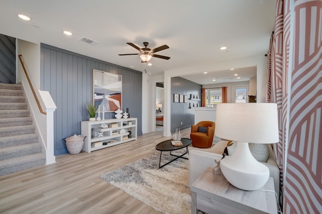 2031 Cora Ivy Ln, Round Rock, TX 78665 - living area with stairs, wood finished floors, ceiling fan, recessed lighting, and wooden walls