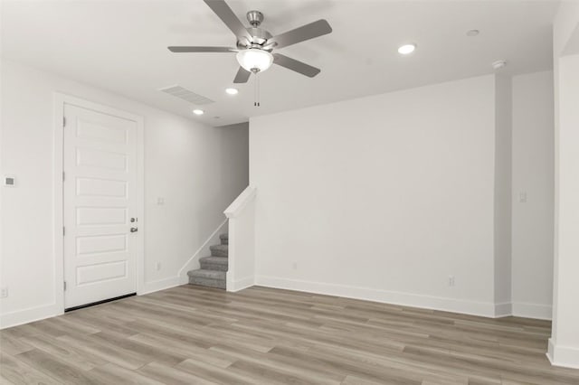 2031 Cora Ivy Ln, Round Rock, TX 78665 - empty room with ceiling fan, stairs, recessed lighting, light wood finished floors, and baseboards