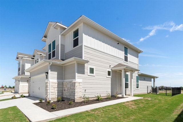 2031 Cora Ivy Ln, Round Rock, TX 78665 - view of front of property with an attached garage, driveway, board and batten siding, and stone siding