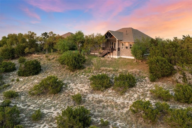 view of back of house at dusk