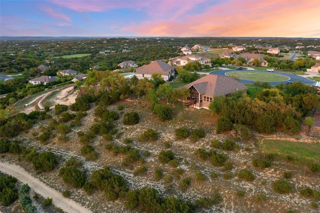 aerial view of property and surrounding area with nearby suburban area