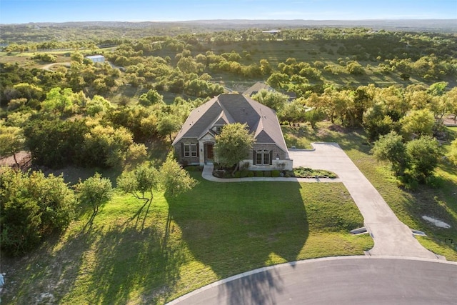 view from above of property with a forest