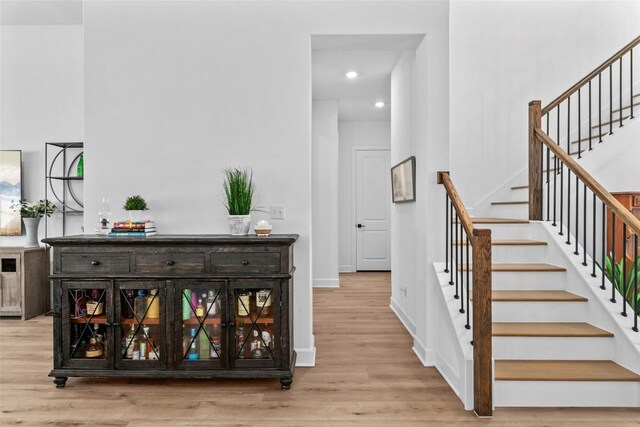 1890 Headwaters Blvd, Dripping Springs, TX 78620 - staircase with wood finished floors and recessed lighting