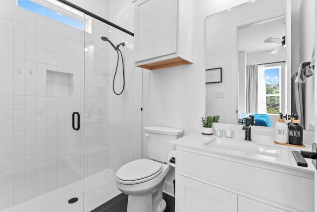 1890 Headwaters Blvd, Dripping Springs, TX 78620 - full bathroom with vanity, a stall shower, ensuite bathroom, and a ceiling fan