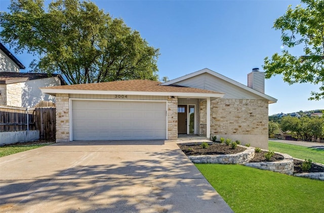 3004 Boone Dr, Lago Vista, TX 78645 - view of front facade featuring driveway, a chimney, a garage, and stone siding