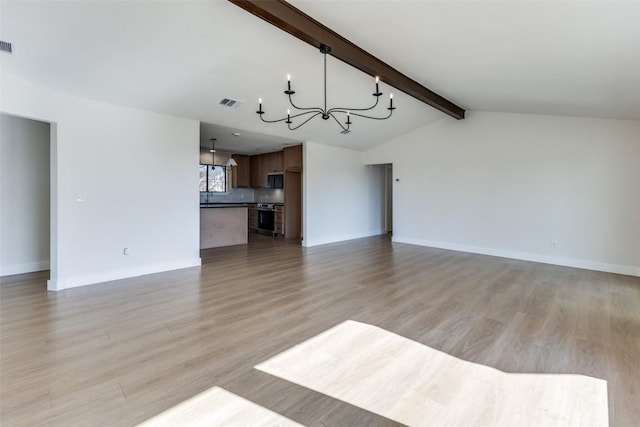 3004 Boone Dr, Lago Vista, TX 78645 - unfurnished living room featuring a chandelier and light wood-type flooring