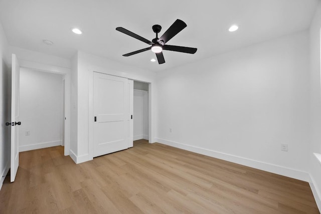 240 Hanauma Dr, Bastrop, TX 78602 - unfurnished bedroom featuring light wood-style floors, recessed lighting, baseboards, and a closet