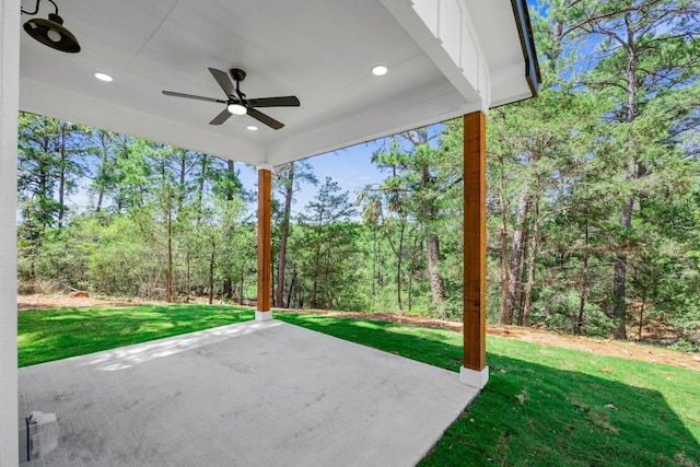 240 Hanauma Dr, Bastrop, TX 78602 - view of patio / terrace with a ceiling fan and a wooded view