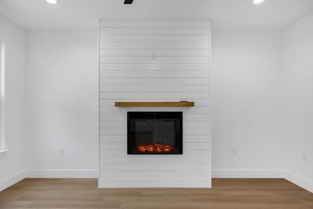 240 Hanauma Dr, Bastrop, TX 78602 - detailed view of recessed lighting, wood finished floors, baseboards, and a fireplace