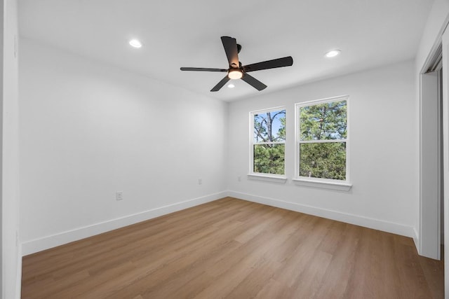 240 Hanauma Dr, Bastrop, TX 78602 - empty room with a ceiling fan, recessed lighting, light wood finished floors, and baseboards